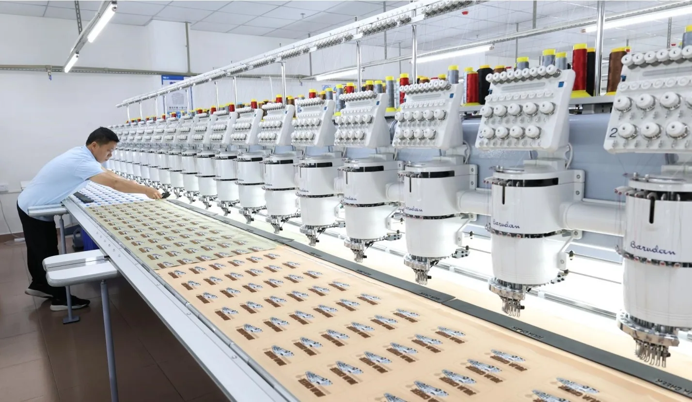 Barudan embroidery line running a live cap order in-house