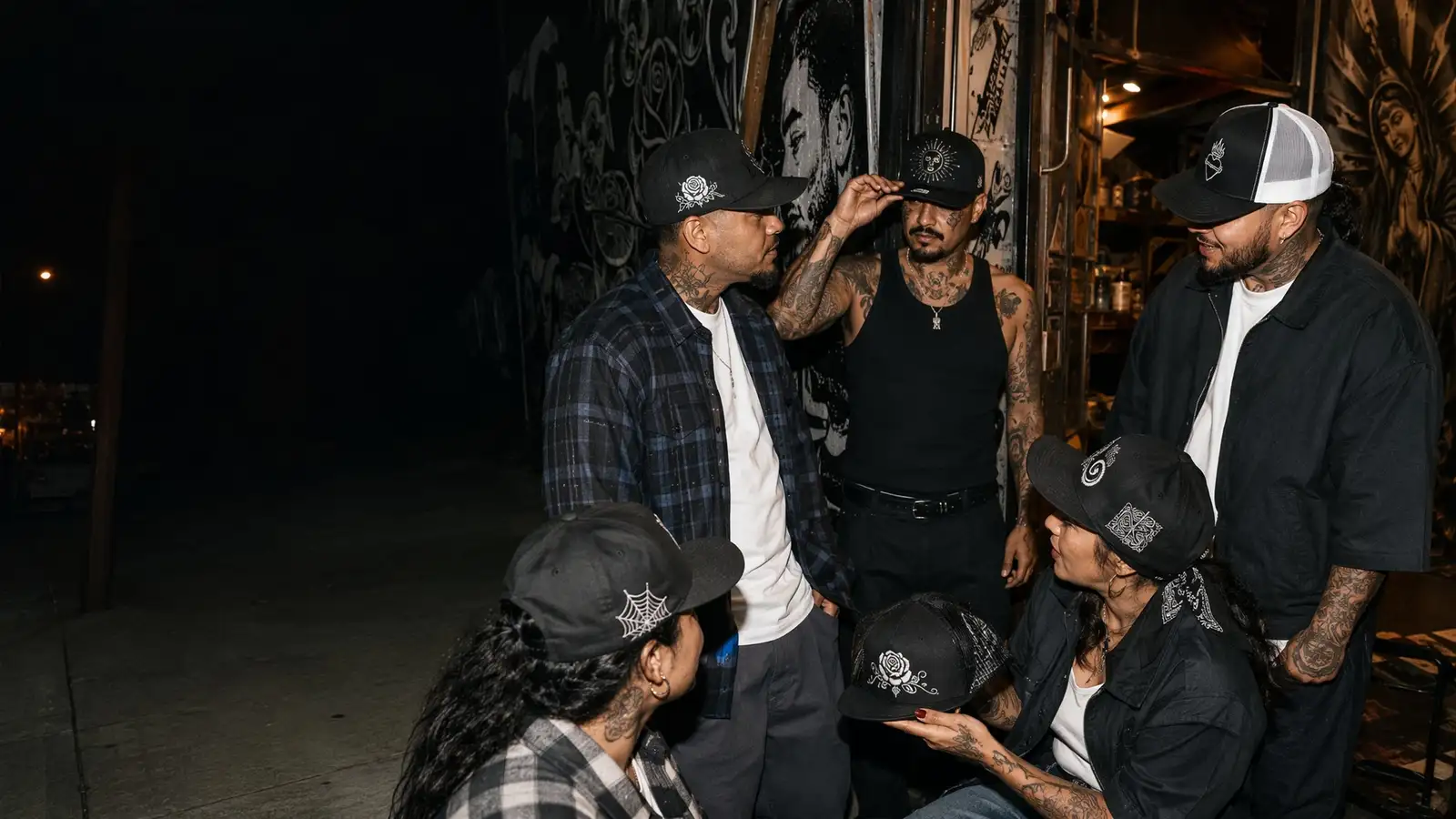 Fictional streetwear group showcasing multiple custom cap shapes and embroidery styles.